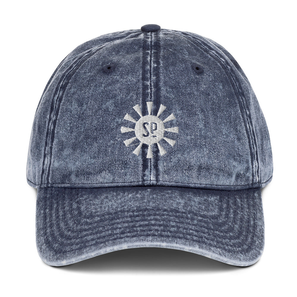 vintage navy ball cap with sun image and SP in the middle